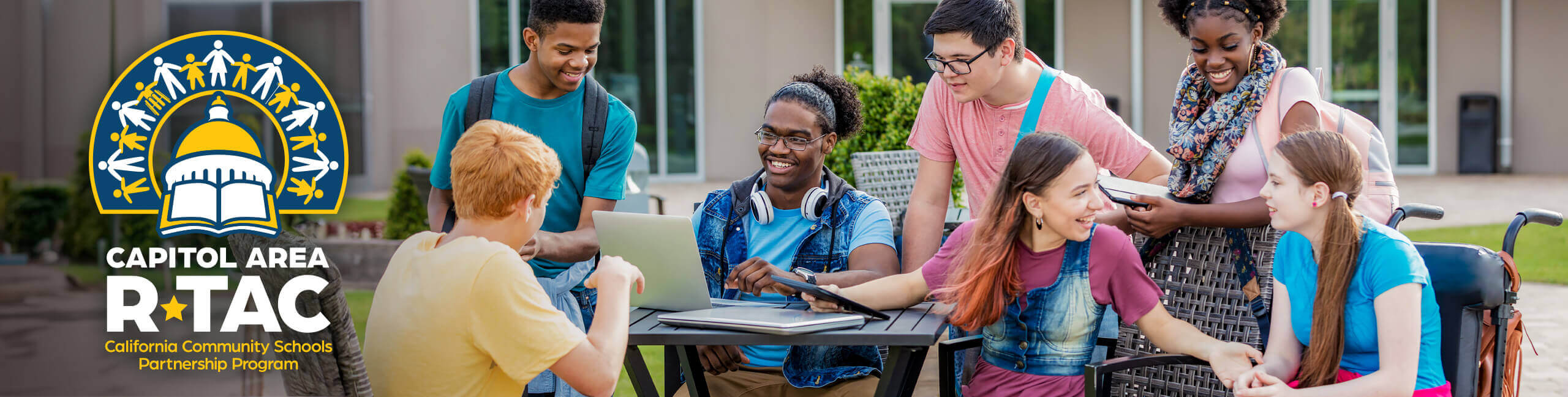 A group of high schoolers work on homework together.